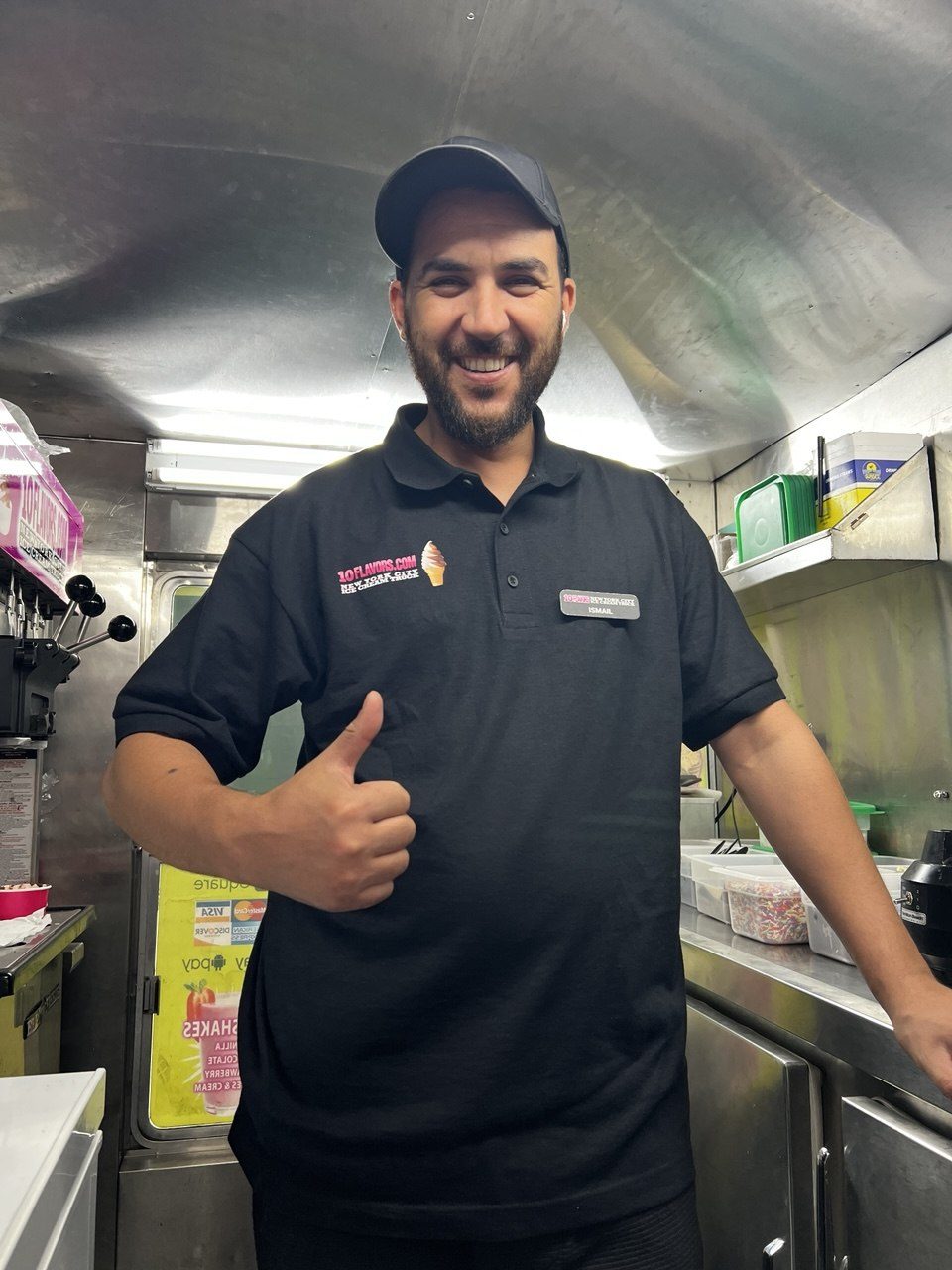 10 Flavors truck team member giving a thumbs up inside the truck