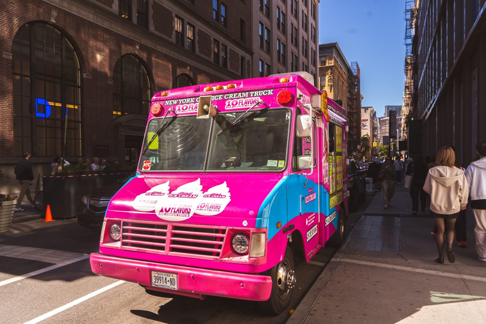 Front view of the 10 Flavors ice cream truck parked on a New York City street