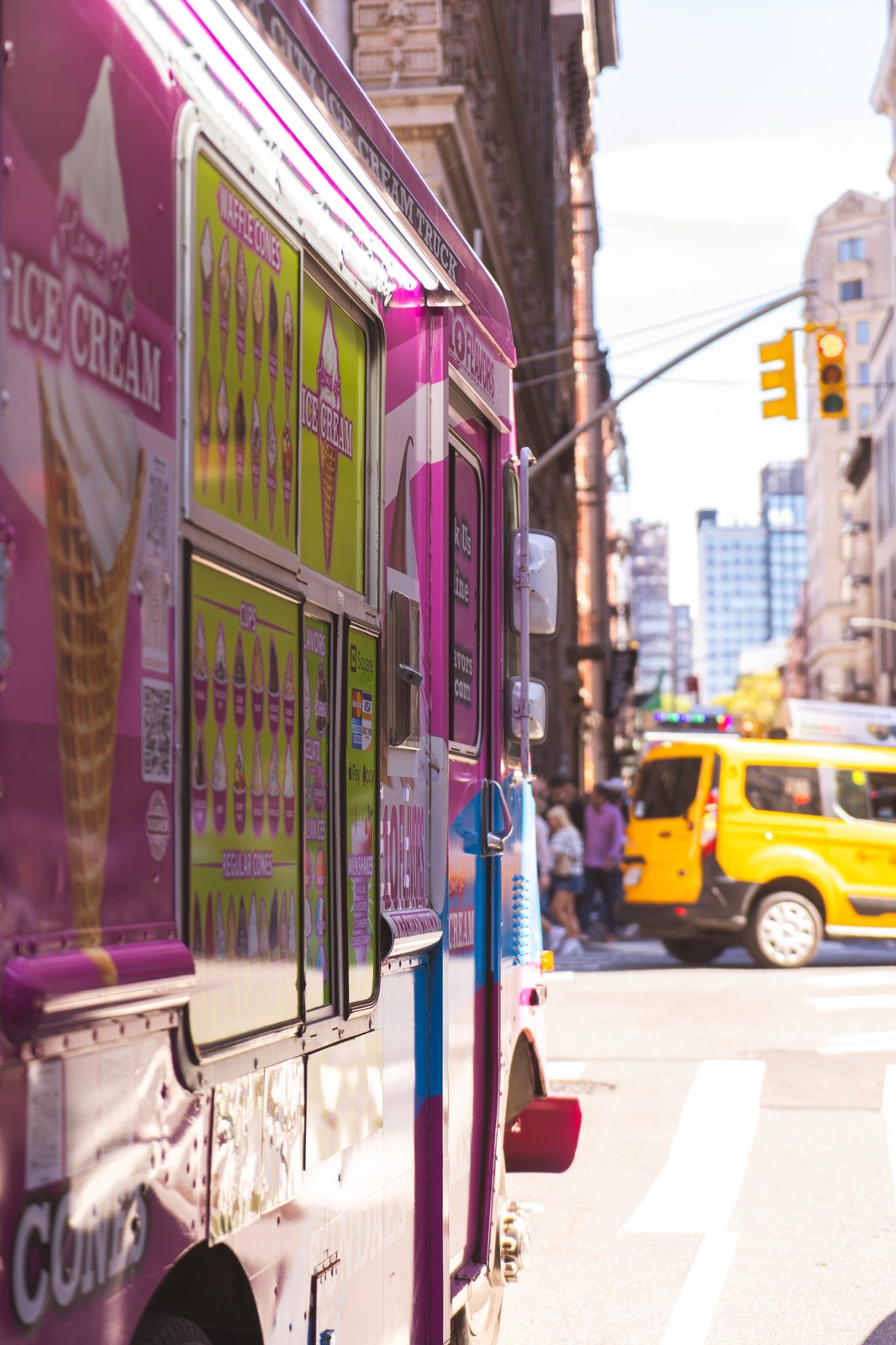 Close-up of the 10 Flavors ice cream truck side menu panels on a New York City street